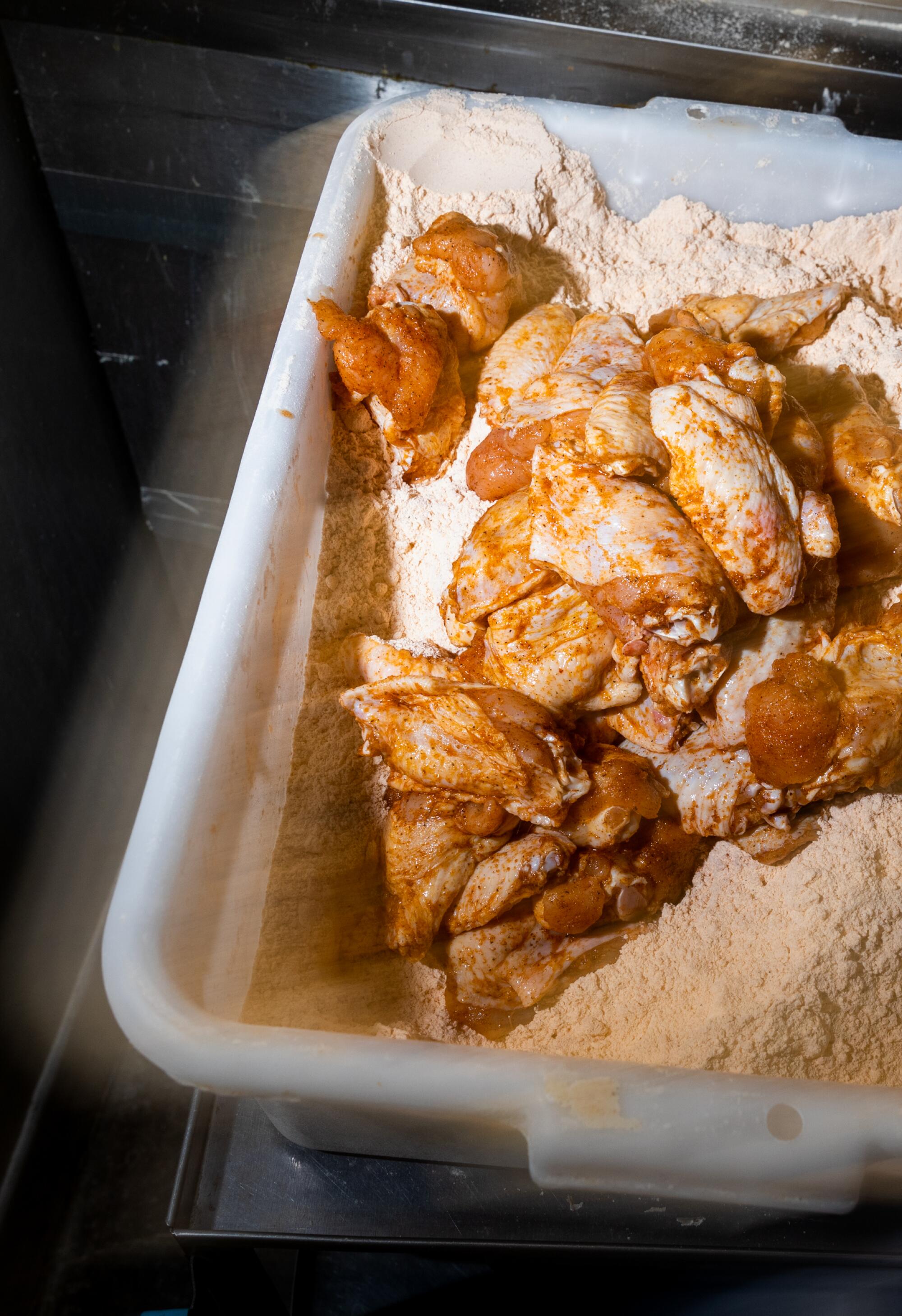 Chicken wings tossed in seasoning.