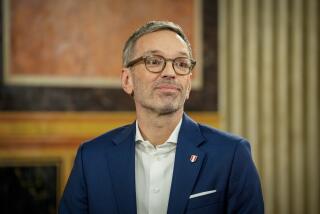 Herbert Kickl, leader of the Freedom Party of Austria smiles at the national broadcaster studio, set up in the parliament building, in Vienna, Austria, Sunday, Sept. 29, 2024, after polls closed in the country's national election. (AP Photo/Andreea Alexandru)