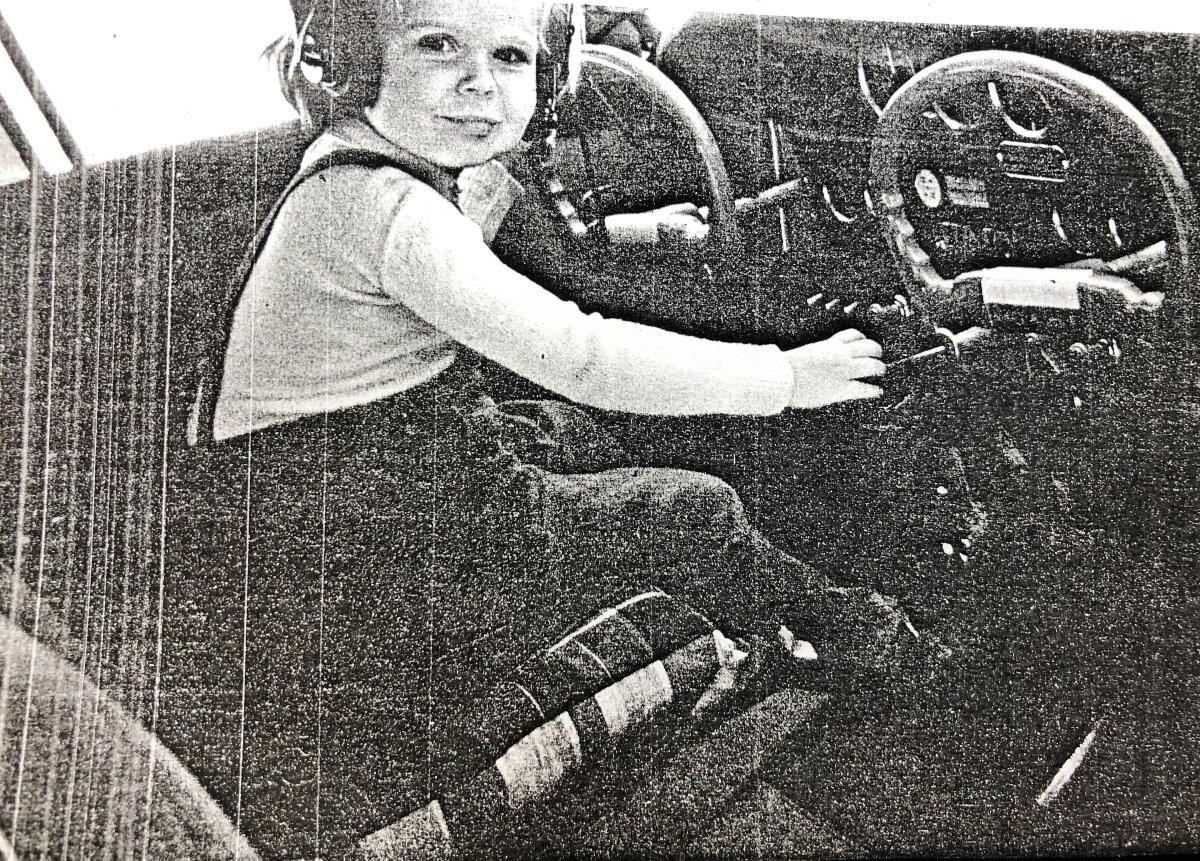 Ann Rothwell is pictured in 1949 at age 3 in the cockpit of her mother's airplane in San Diego.