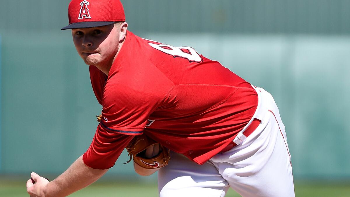 Angels prospect Sean Newcomb delivers a pitch against the Royals during a spring training game on March 8.