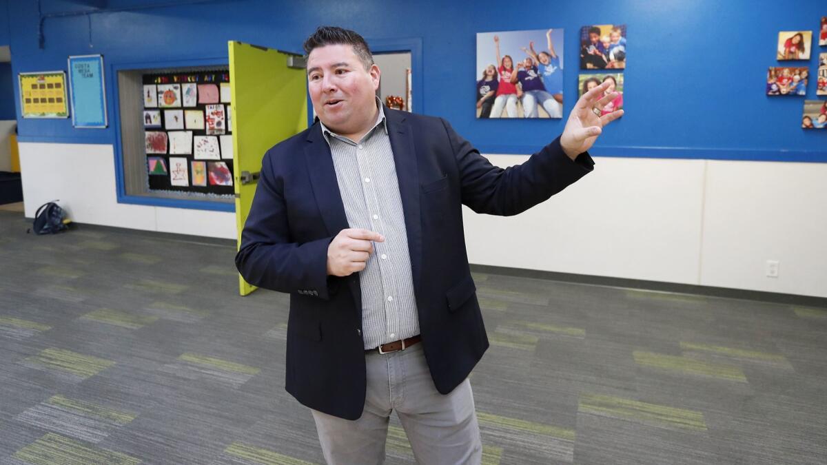 Robert Santana, chief executive of the Boys & Girls Clubs of Central Orange Coast, speaks last week about upgrades planned for the organization’s Costa Mesa location.