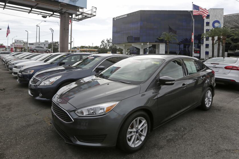 In this Tuesday, Jan. 17, 2017, photo, certified pre-owned vehicles sit on display at an auto dealership in Miami. A certified pre-owned vehicle costs more than a regular used car, but it can give buyers some peace of mind in an often murky market. Certified pre-owned vehicles are used cars, usually newer, coming off two- or three-year leases, that are backed by an automaker’s guarantee. (AP Photo/Alan Diaz)