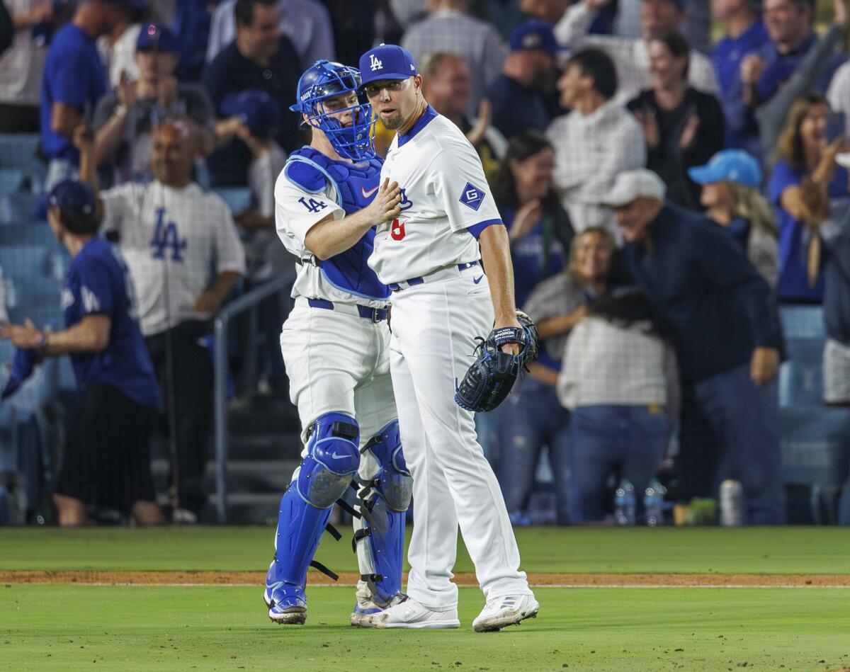 Dodgers reliever Blake Treinen, right, celebrates with catch Will Smith after the final out of Game 1.