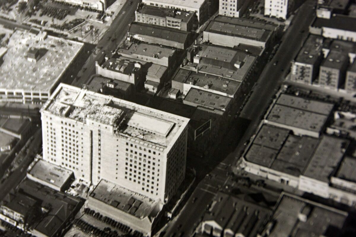 DeLyser and Greenstein pored through the archives of two photography companies that took aerial shots of the evolving Los Angeles landscape from 1918 to 1971. Anthony's "Packard" billboard wasn't there in 1922, or 1923 or 1924. Then, in a photo dated 1925, an electrified billboard appears on the hotel building's roof. And, in a photo taken from another angle, an illuminated "Packard" logo is just visible on the front of the sign.