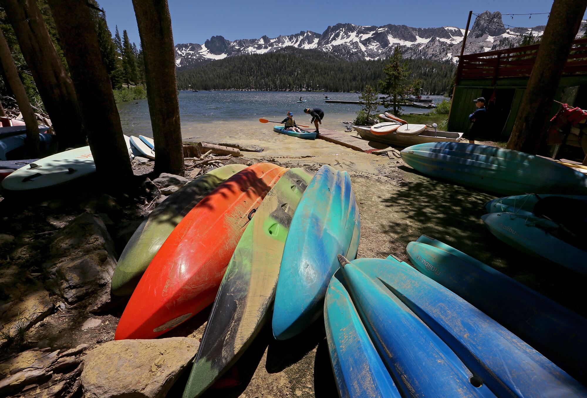A kayaker returns to shore after paddling around Lake Mary in the Mammoth Lakes basin.