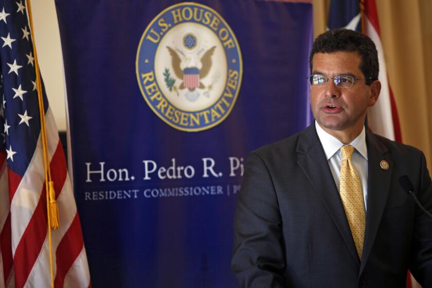 FILE - In this Sept. 24, 2013 file photo, Pedro Pierluisi, Puerto Rico's representative in the U.S. Congress, speaks during a conference in San Juan, Puerto Rico. A Puerto Rico legislator said Tuesday, July 30, 2019, that the U.S. territory’s embattled governor plans to nominate Pierluisi as secretary of state. (AP Photo/Ricardo Arduengo, File)
