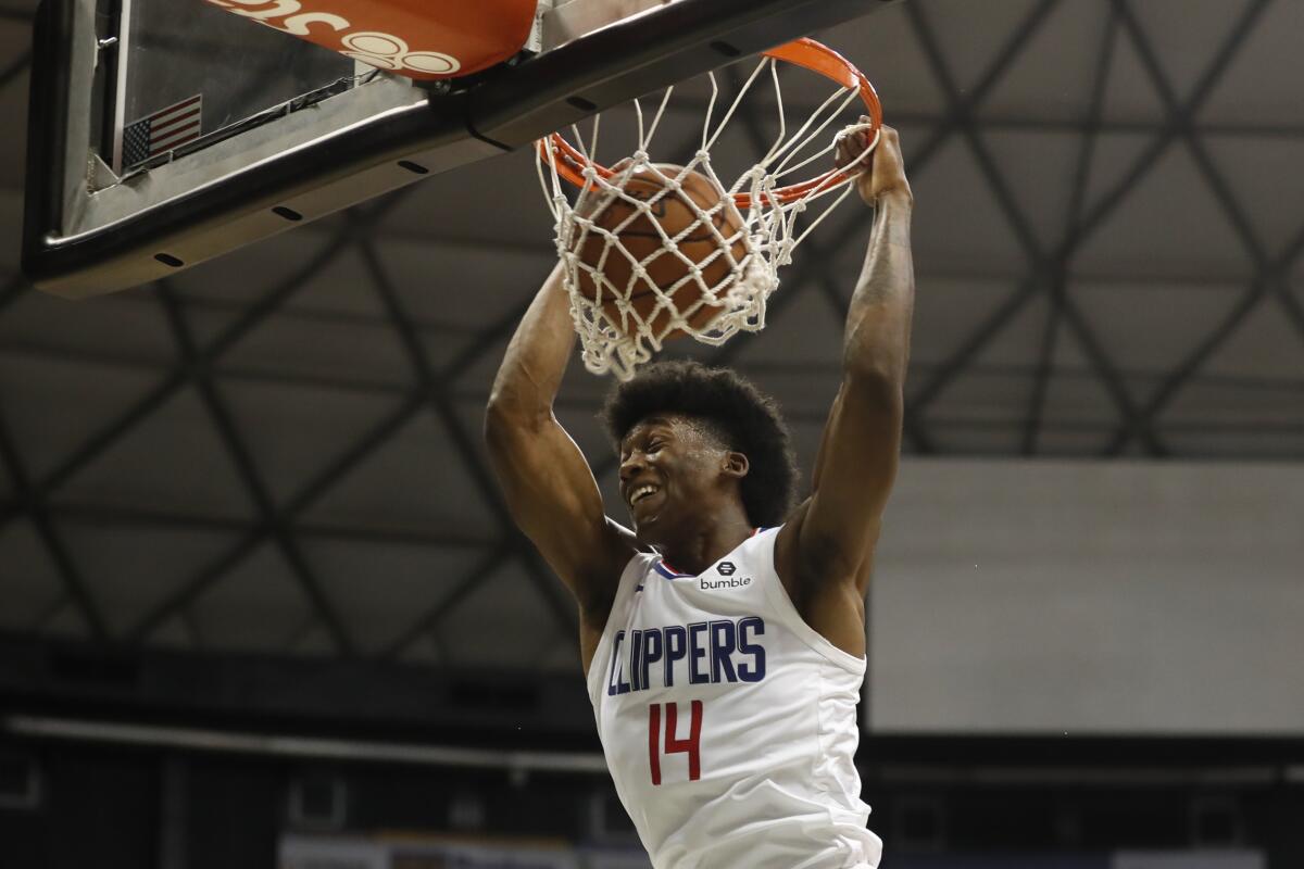 Clippers guard Terance Mann dunks during the third quarter of a preseason game against the Houston Rockets on Thursday.