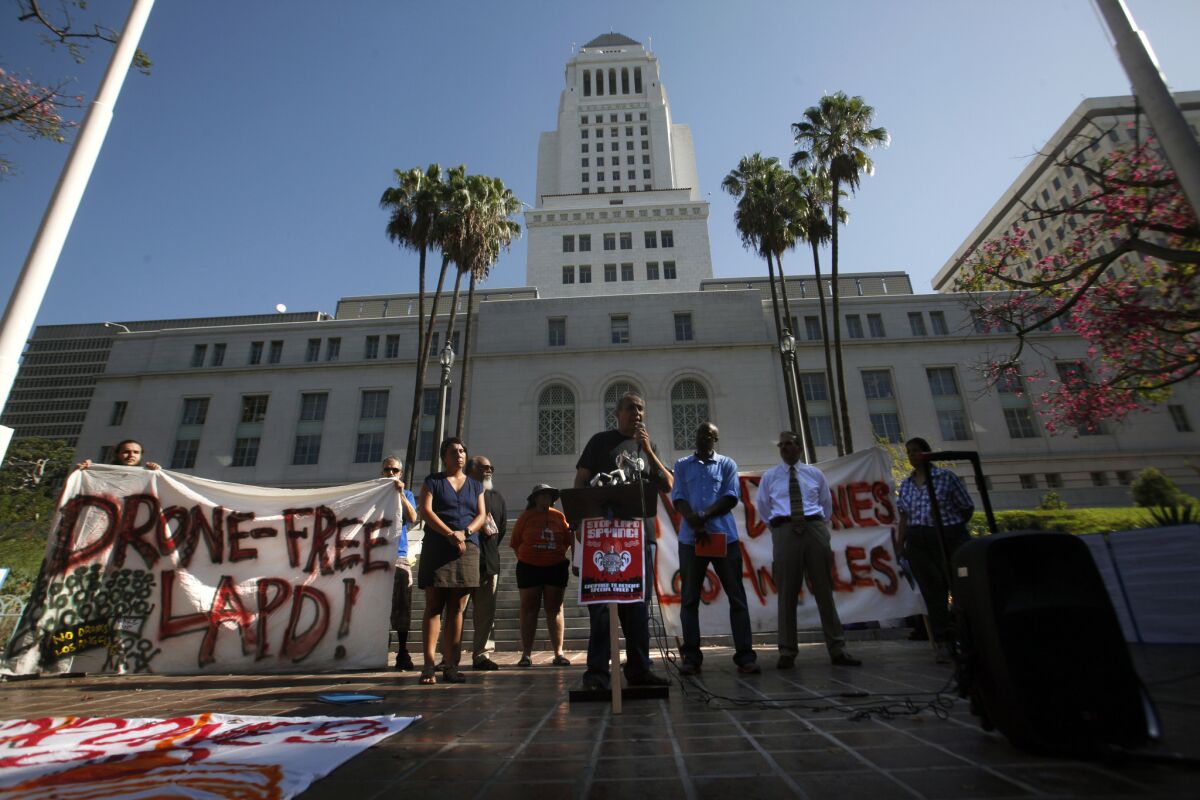 Activists seeking to limit the use of drones by law enforcement protested on the south steps of City Hall.