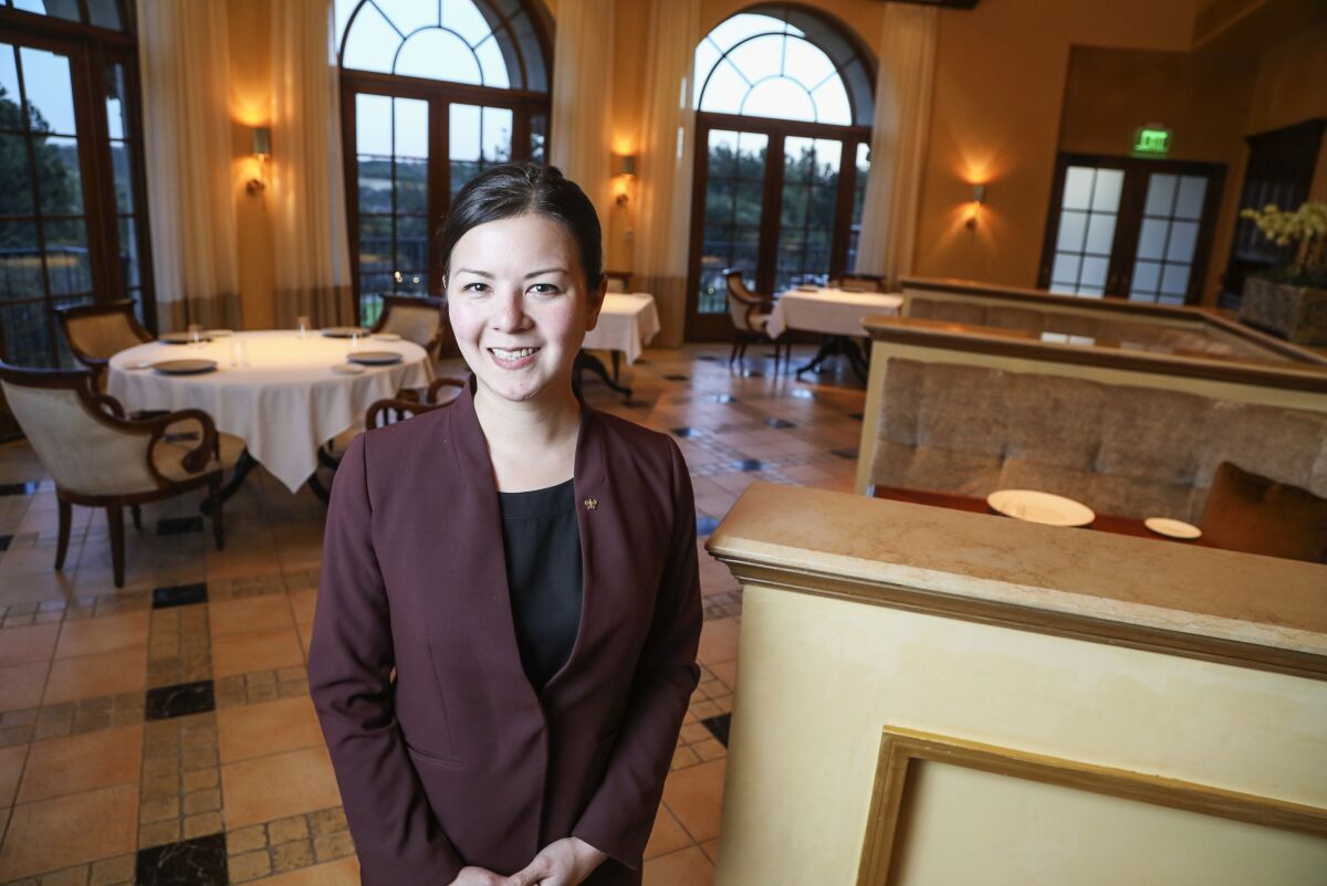 The new wine director Victoria O'Bryan poses for photos in the newly remodeled dinning area at Addison on January 29, 2020 in San Diego, California.