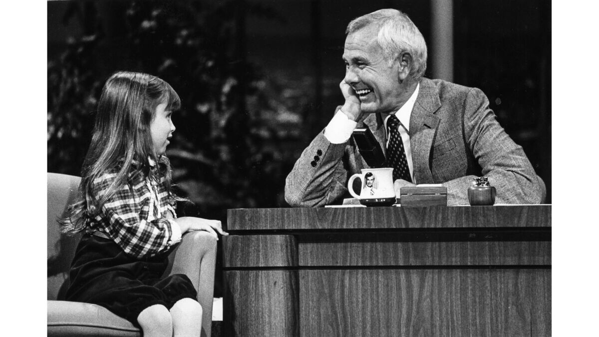 Sept. 15, 1982: During a taping of "The Tonight Show," Johnny Carson gets a laugh with 7-year-old actress Kaleena Kiff.