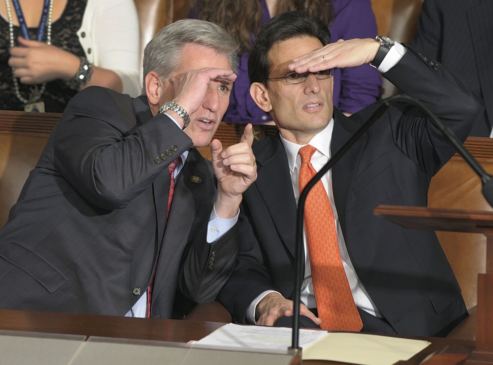Eric Cantor of Va., right, and Kevin McCarthy of Calif. look across the House floor in 2011.