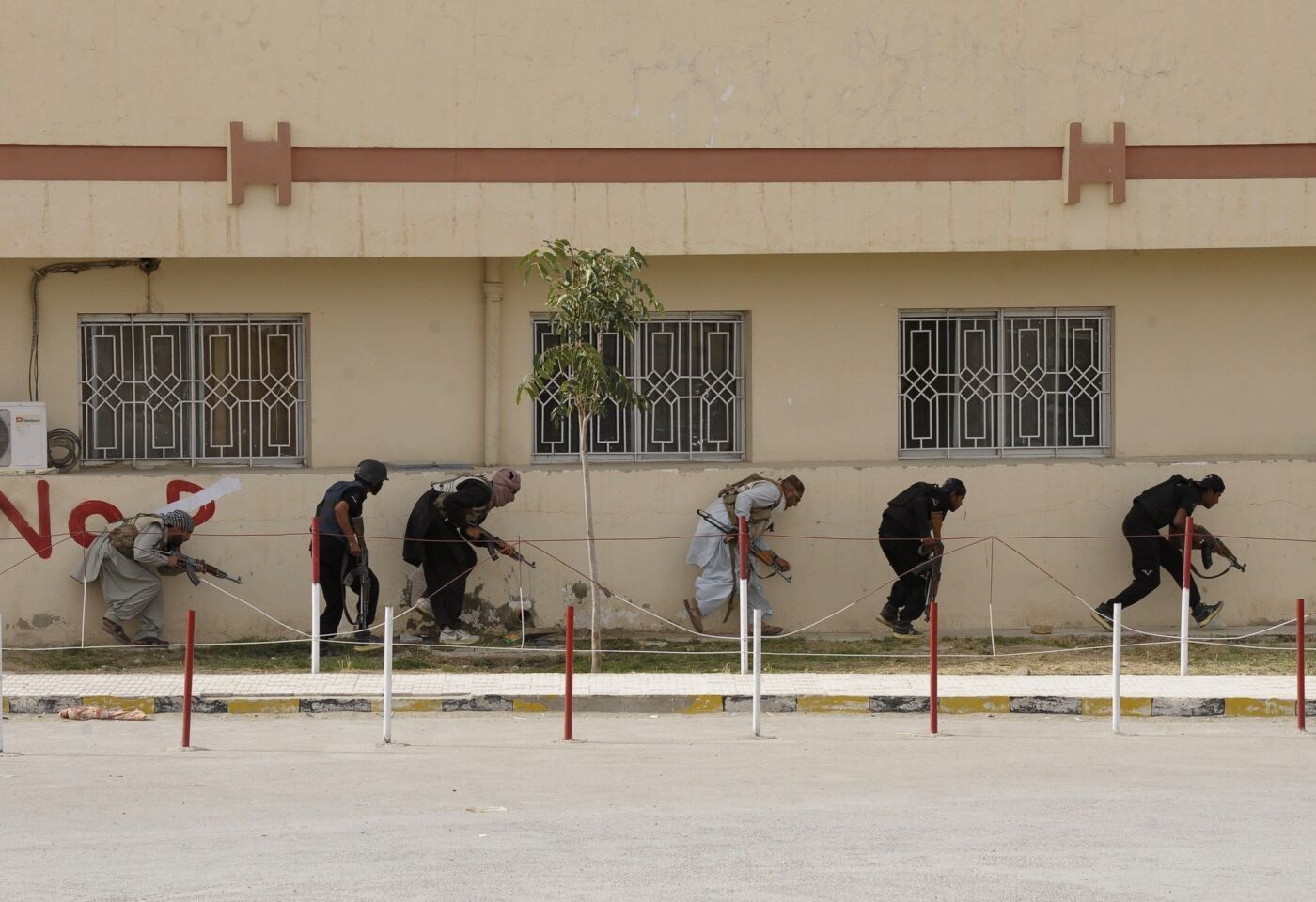 Pakistani paramilitary soldiers take position after militants attacked a hospital in Quetta, the capital of Baluchistan province.