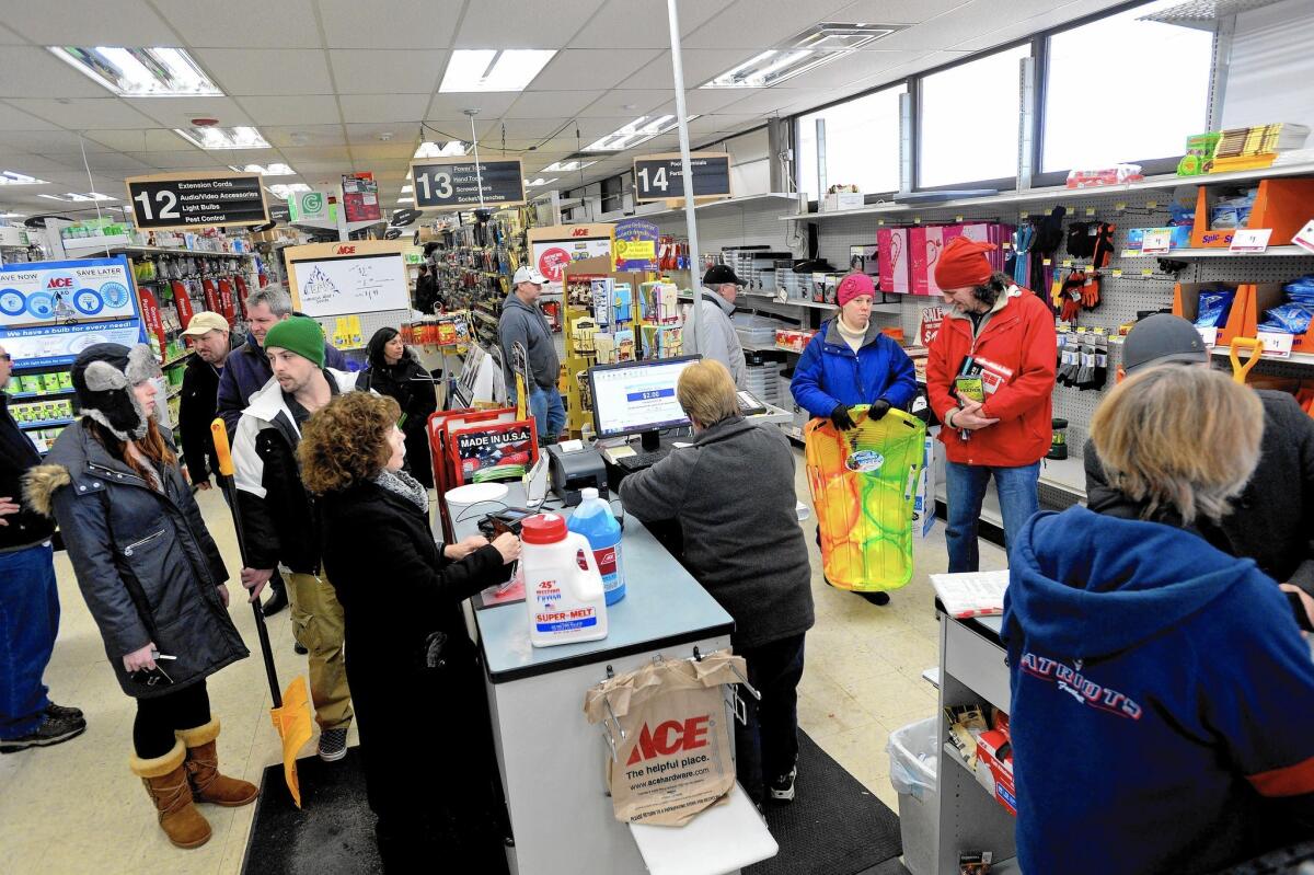 Hardware store shoppers in Winthrop, Mass., buy supplies in January as they prepare for a blizzard expected to hit the Northeast. Bad winter weather crimped the economy.