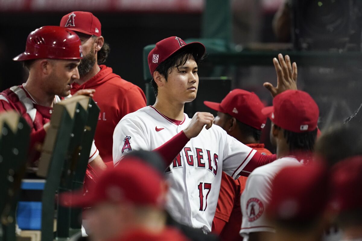 Angels starting pitcher Shohei Ohtani (17) returns to the dugout after pitching during the seventh inning Sep. 3, 2021.