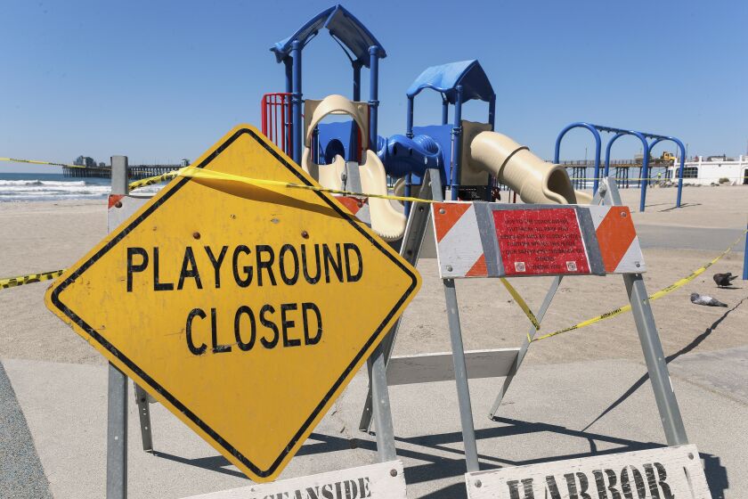 A playground south of the Oceanside Pier is closed on Friday March 27, 2020 in Oceanside, California.