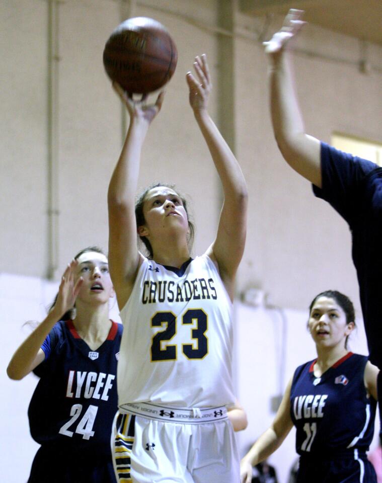 St. Monica Academy girls' basketball player #23 Elena Ford takes a short jumper in home game vs. Le Lycee High School at New Revelation Baptist Church gymnasium in Pasadena on Wednesday, Feb. 3, 2016.