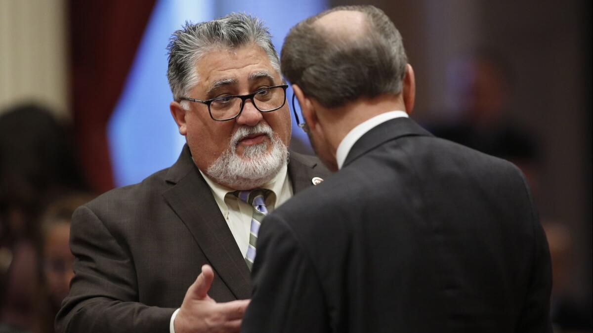 State Sen. Anthony Portantino (D-La Canada Flintridge) left, talks with Sen. Jerry Hill, D-San Mateo during the Senate session at the Capitol on May 16 in Sacramento. Portantino is chairman of the Senate Appropriations Committee, which blocked SB 50.