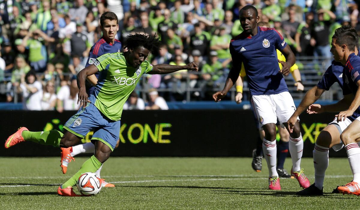 Sounders forward Obafemi Martins prepares to launch a shot that would find the net against Chivas USA in the second half Saturday afternoon in Seattle.