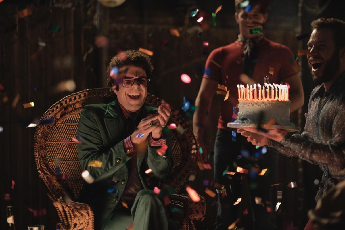 A scene from "The Boys in the Band" shows Zachary Quinto as Howard receiving a birthday cake. 