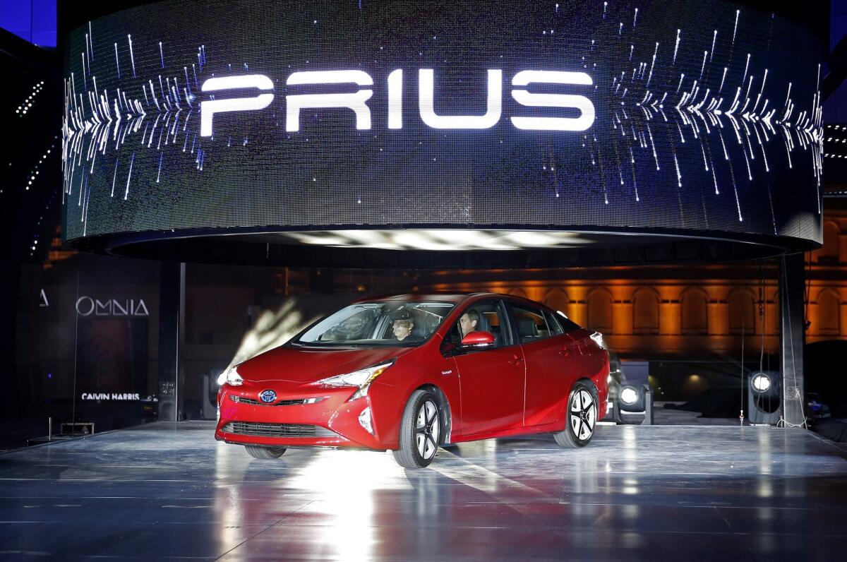 Toyota unveils the latest version of the Prius at an event Tuesday, Sept. 8, 2015, in Las Vegas. The car is still the No. 1 hybrid on the market, but has been a tougher sell for dealers with gas prices below $3 in many areas of the country.