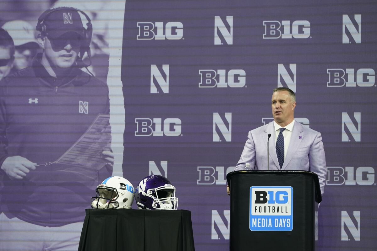 Northwestern coach Pat Fitzgerald talks to reporters during Big Ten Conference media days.