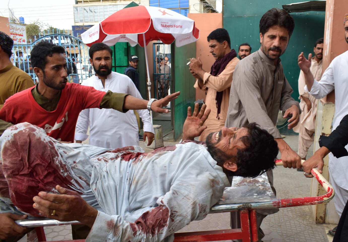 A man hurt in a suicide bombing is taken to a hospital in Quetta on July 13, 2018 following a terror attack at an election rally.