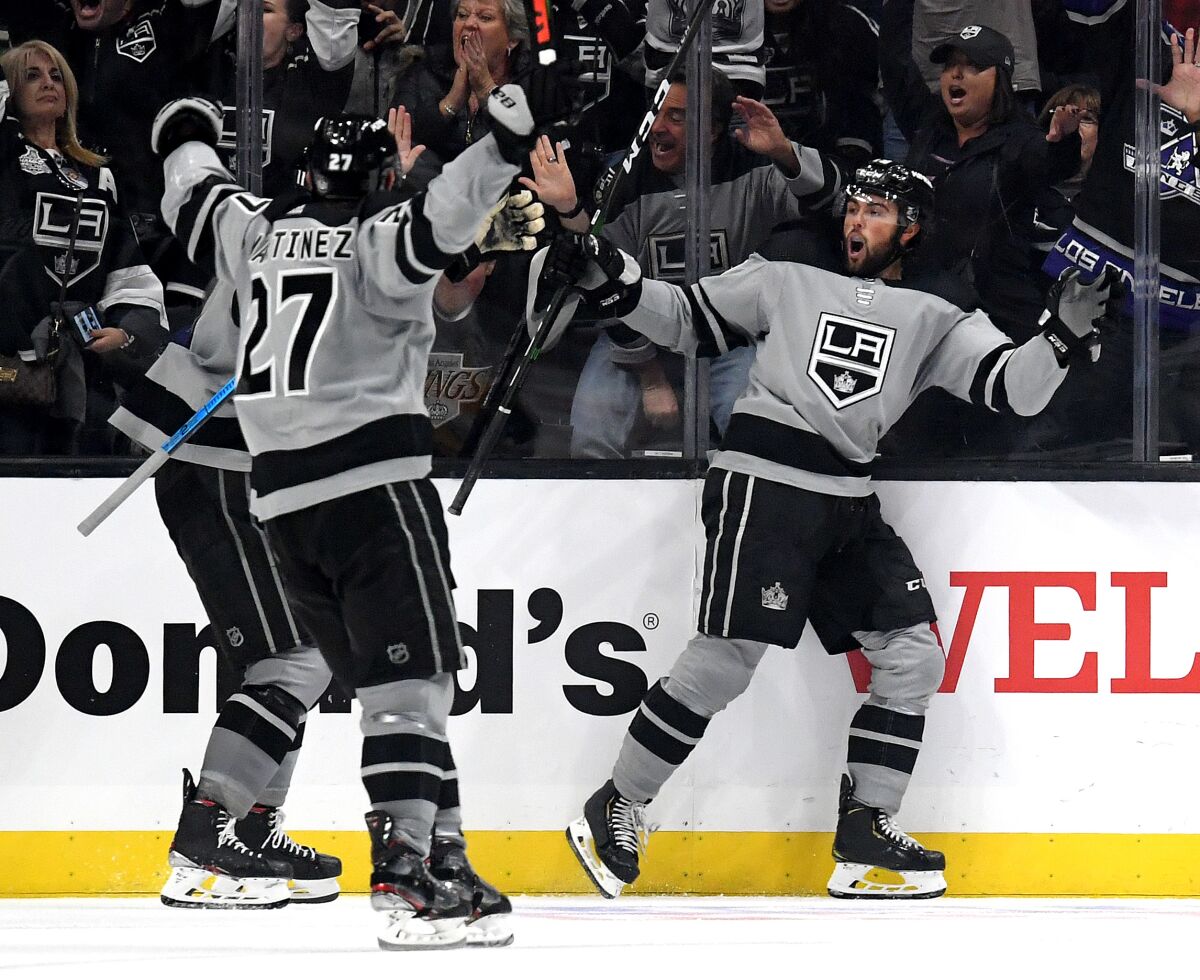The Kings' Alex Iafallo, right, reacts to his goal go-ahead goal during a 7-4 win at Staples Center on Saturday.
