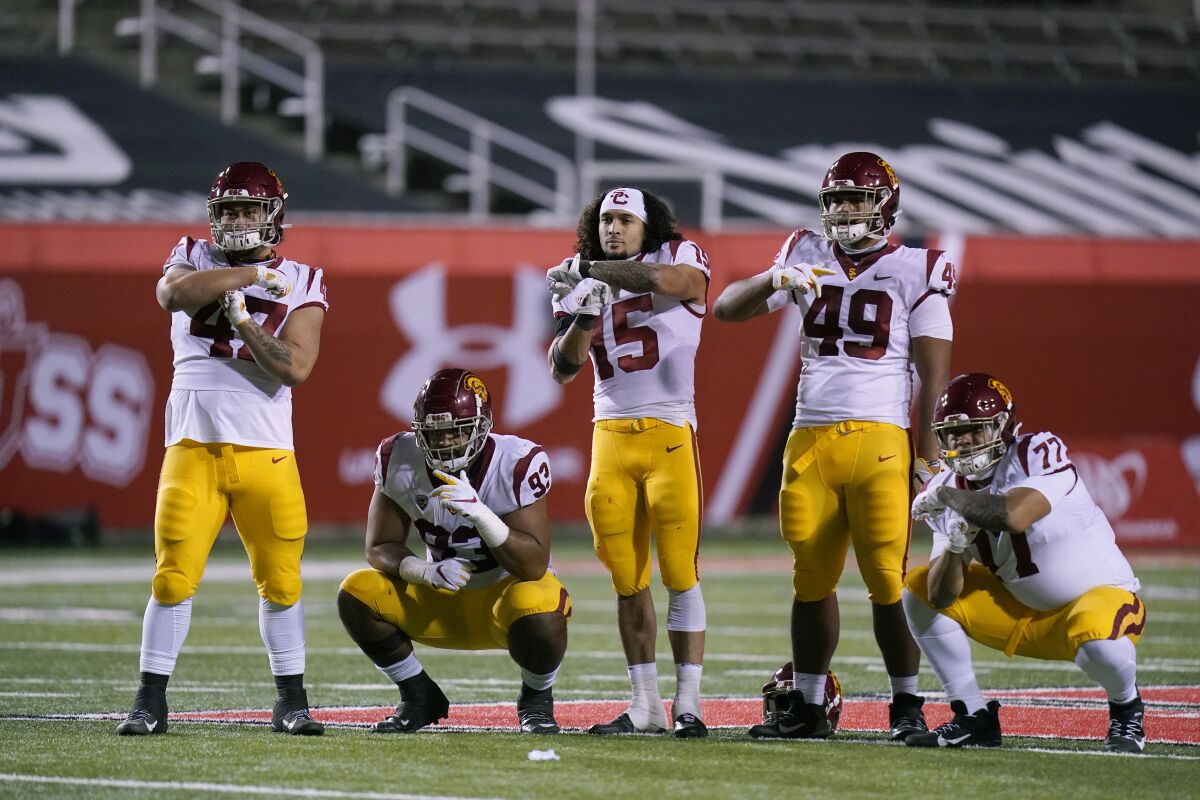 Southern California players pose for a photograph after their NCAA college football game against Utah Sunday, Nov. 22, 2020, in Salt Lake City. (AP Photo/Rick Bowmer)
