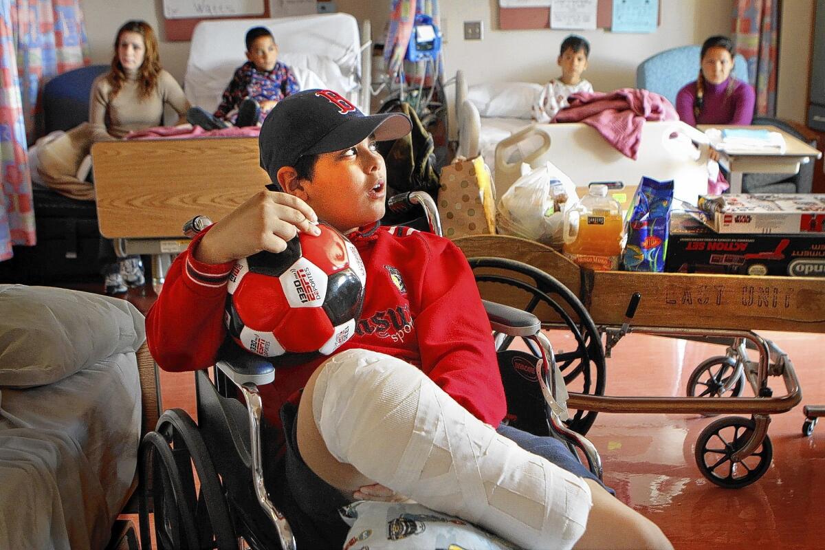 Abdullah Alathamna, 11, prepares to leave a Los Angeles hospital in 2010. He lost a foot in 2006 when the Israeli military accidentally shelled his house while targeting militants who had launched rockets into Israel. Nineteen people were killed, including his mother and two sisters.