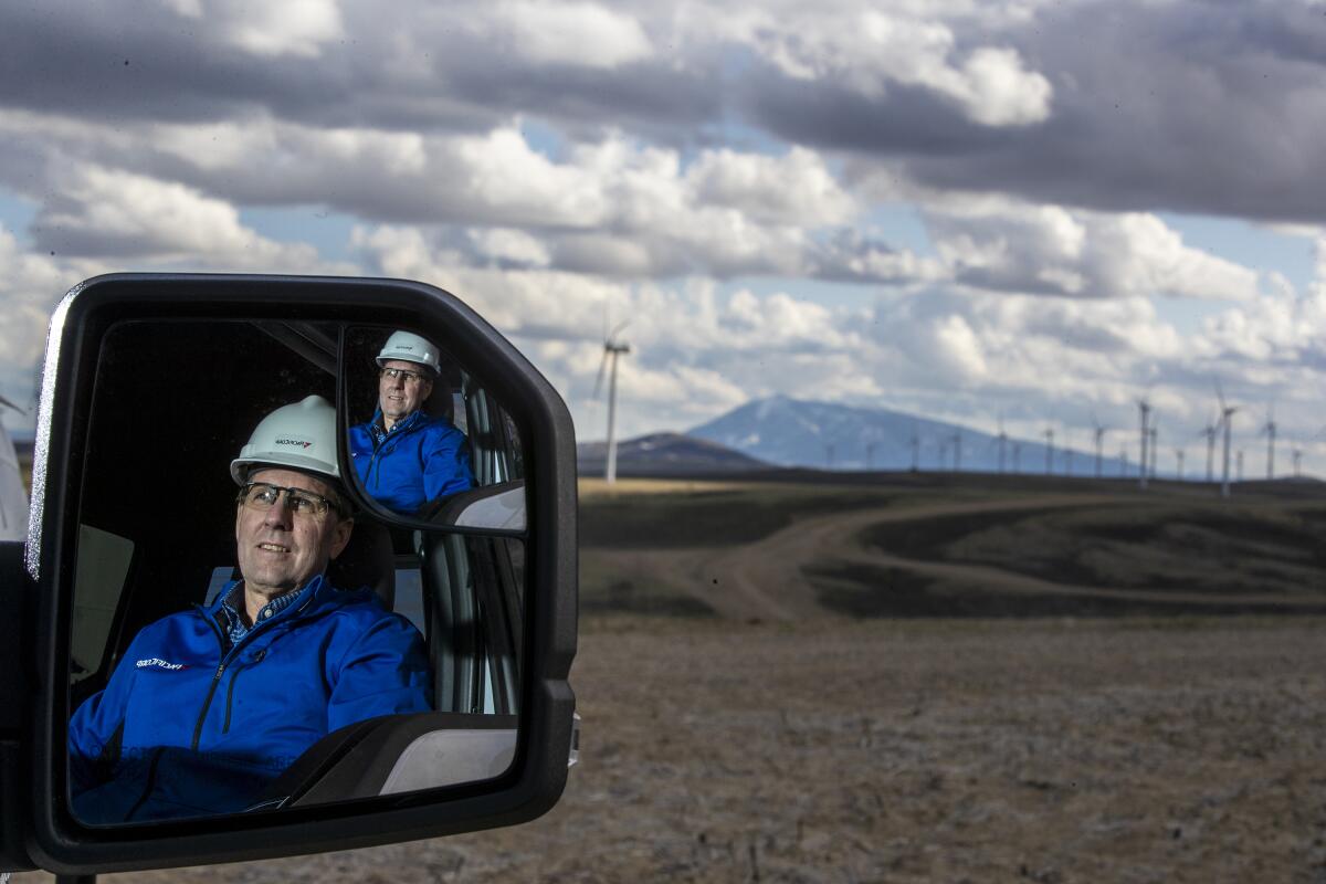 Laine Anderson, director of wind operations at utility company PacifiCorp, marvels at a Wyoming wind farm.