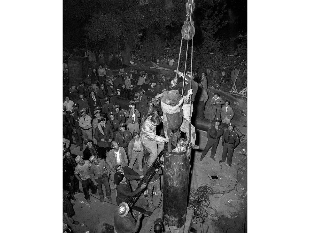 April 10, 1949: The body of Kathy Fiscus is brought to the surface during rescue operations in San Marino. This photo appeared on Page One of the next morning's Los Angeles Times.