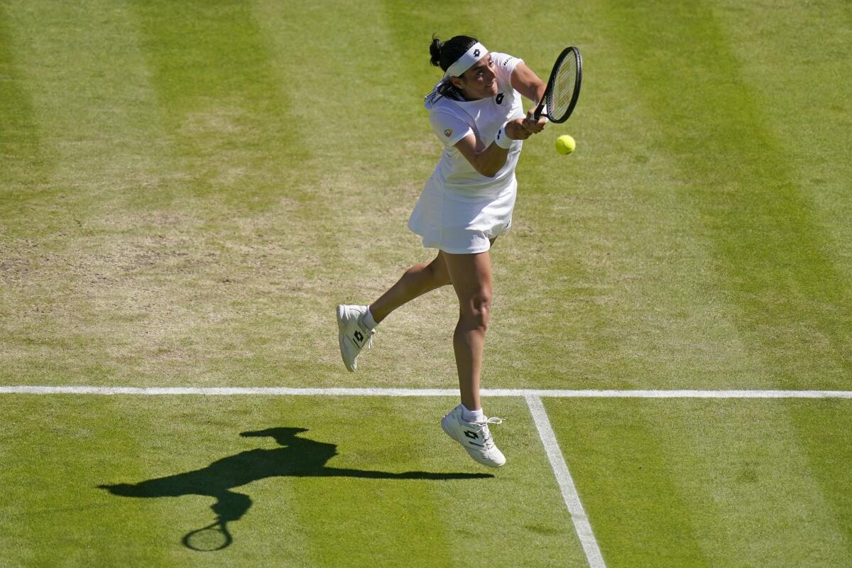 Tunisia's Ons Jabeur returns to Germany's Tatjana Maria in a women's singles semifinal match on day eleven of the Wimbledon tennis championships in London, Thursday, July 7, 2022. (AP Photo/Gerald Herbert)