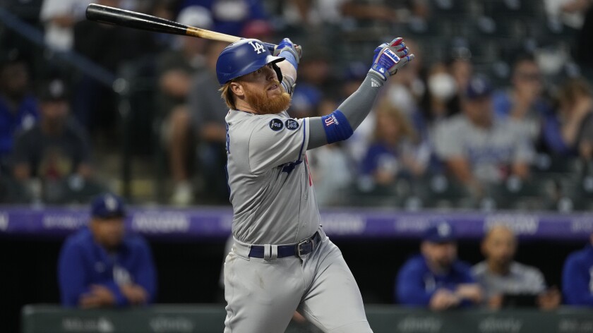 Dodgers third baseman Justin Turner hits the Colorado Rockies on Wednesday.