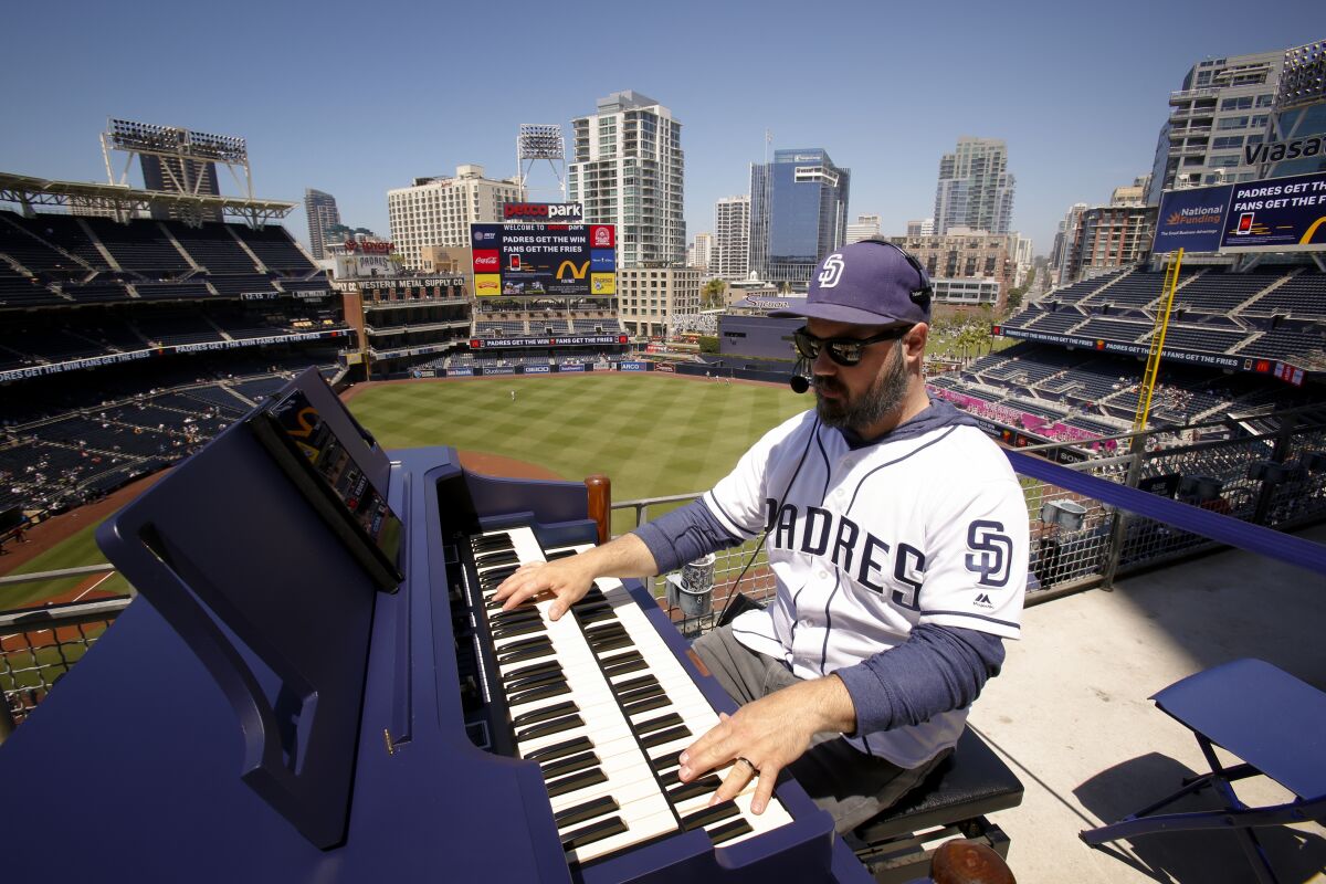 Padres organ player Bobby Cressey gets ready for the game against the Seattle Mariners at Petco Park on Wednesday.