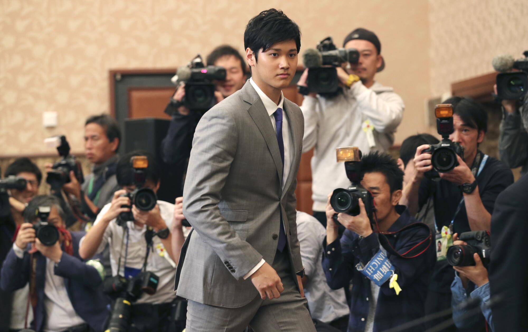 Pitcher-outfielder Shohei Ohtani arrives for a news conference at the Japanese National Press Center on Nov. 11, 2017.