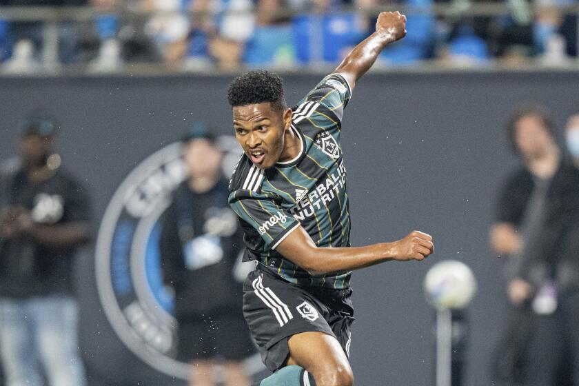 LA Galaxy midfielder Rayan Raveloson (6) plays against the Charlotte FC during the second half of an MLS soccer match in Charlotte, N.C., Saturday, March 5, 2022. (AP Photo/Jacob Kupferman)