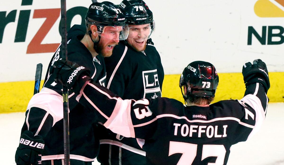 Kings forwards Jeff Carter, left, Tanner Pearson and Tyler Toffoli -- the "70s line" -- celebrate a goal against the Blackhawks in Game 4 of the Western Conference finals last season.