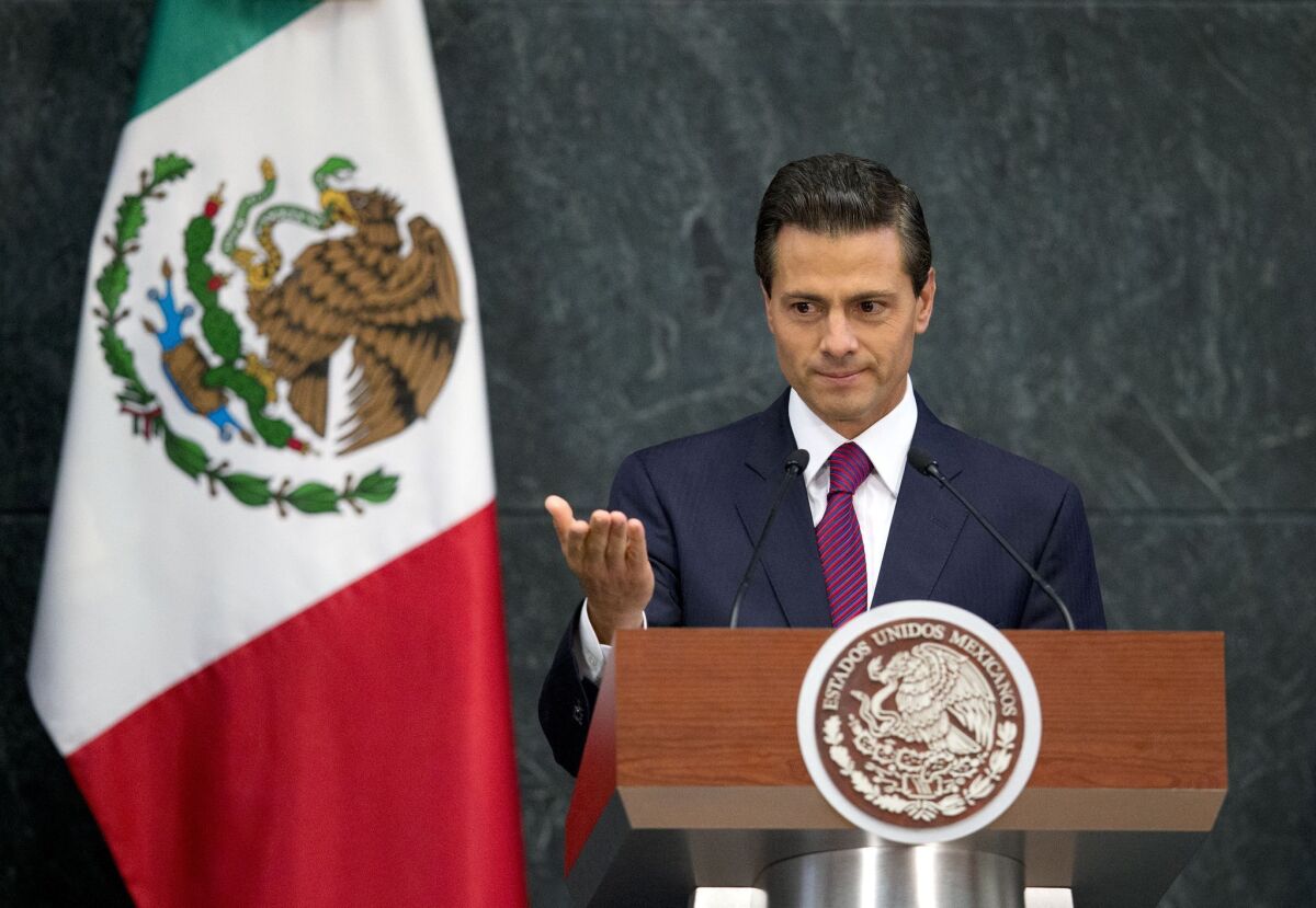 In this Aug. 27 photo, Mexico's President Enrique Pena Nieto speaks during a news conference to announce Cabinet changes.