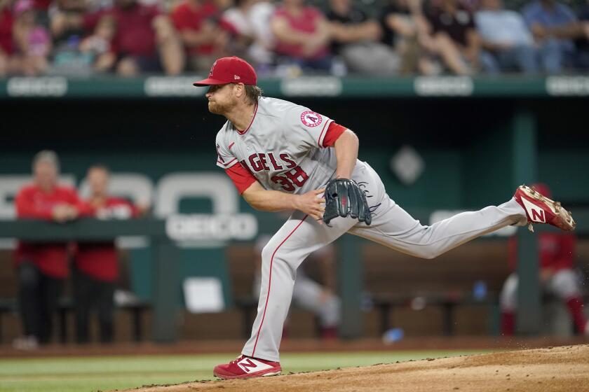 Los Angeles Angels starting pitcher Alex Cobb follows through on his delivery in the second inning of a baseball game against the Texas Rangers in Arlington, Texas, Thursday, Sept. 30, 2021. (AP Photo/Tony Gutierrez)