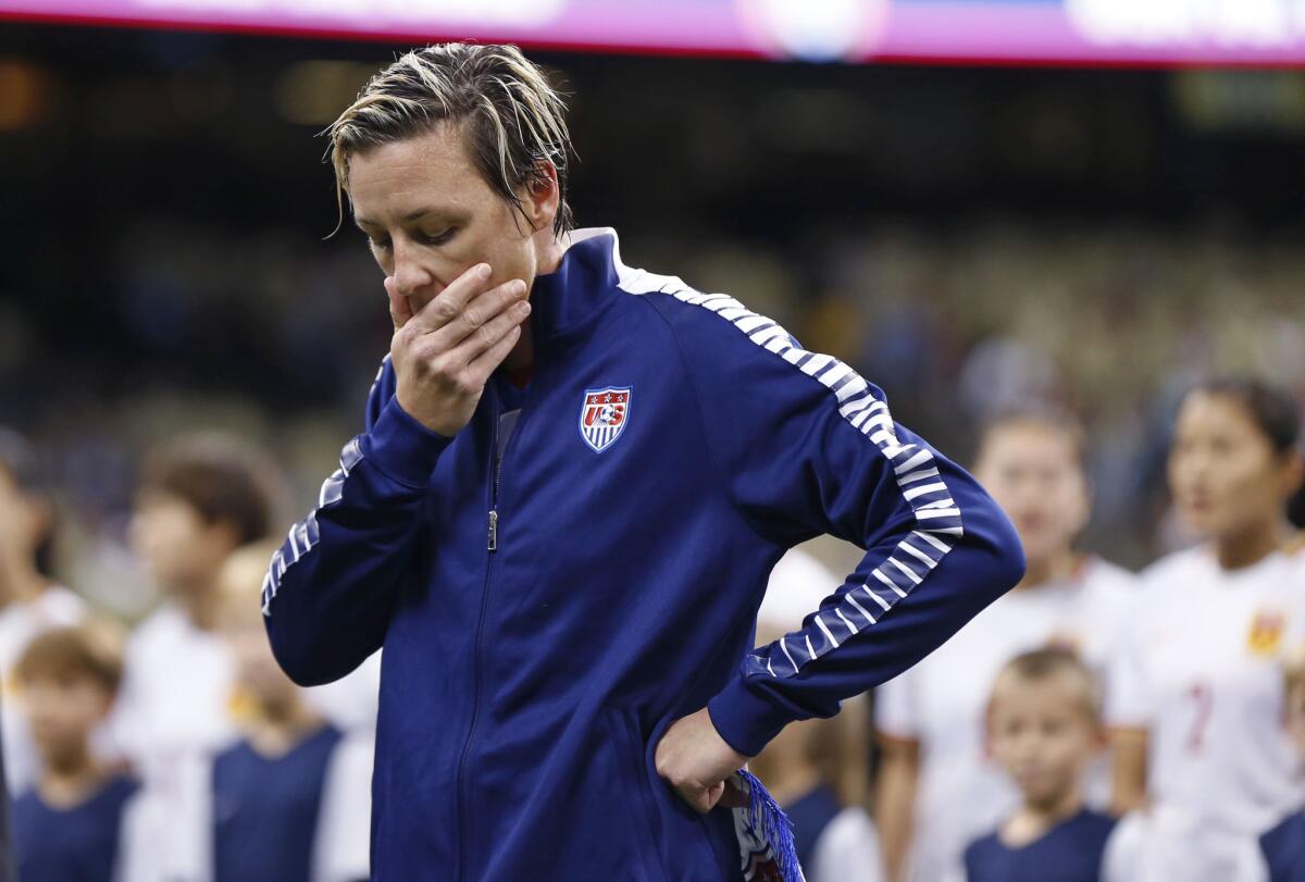 U.S. forward Abby Wambach reacts during a presentation for her final game before the team's international friendly soccer match against China in New Orleans.