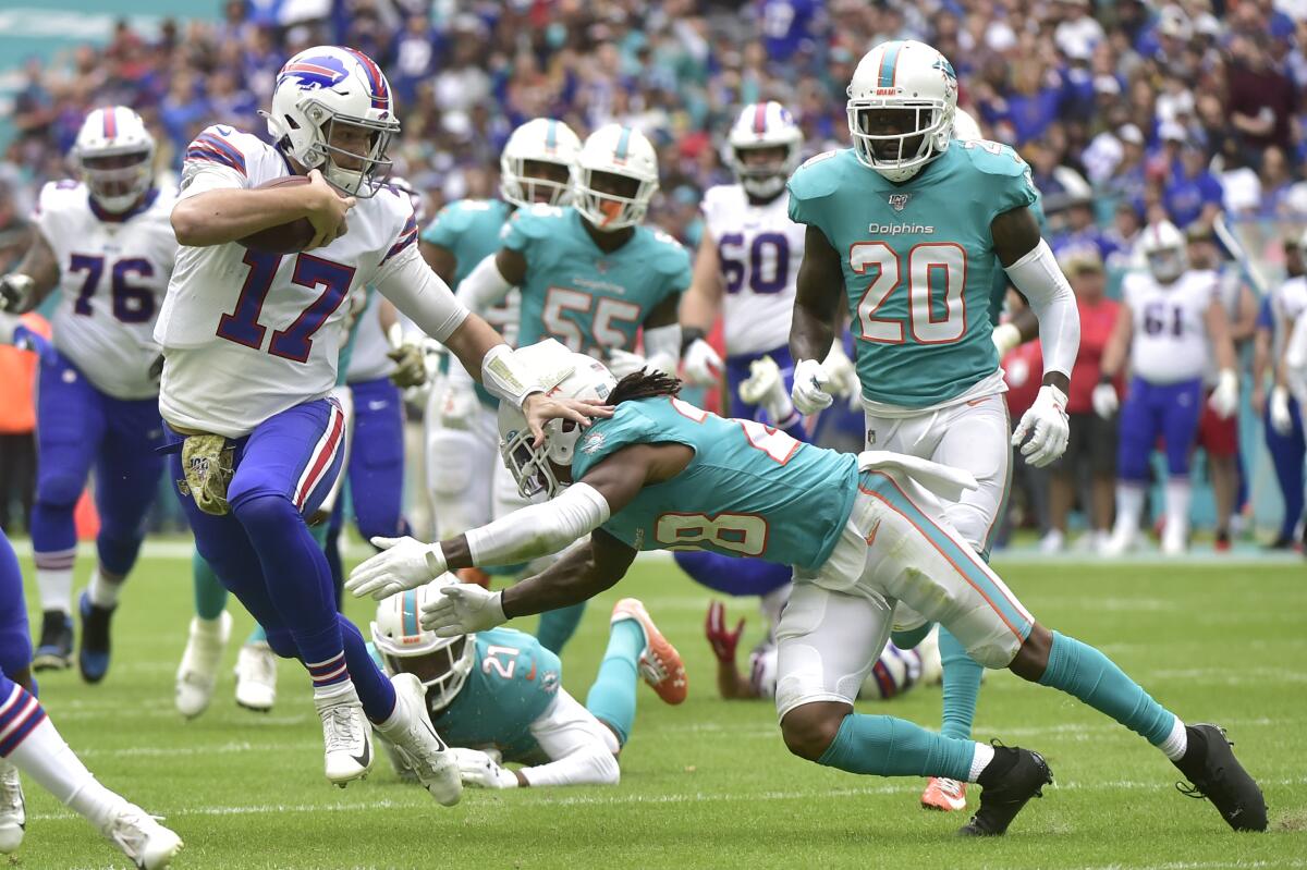 Bills quarterback Josh Allen scrambles during a game Nov. 17 against the Dolphins at Hard Rock Stadium. 