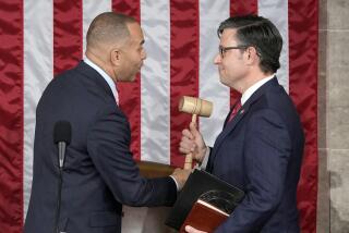 House Minority Leader Hakeem Jeffries of N.Y., hands the gavel to speaker-elect Rep. Mike Johnson, R-La., at the Capitol in Washington, Wednesday, Oct. 25, 2023. (AP Photo/Alex Brandon)