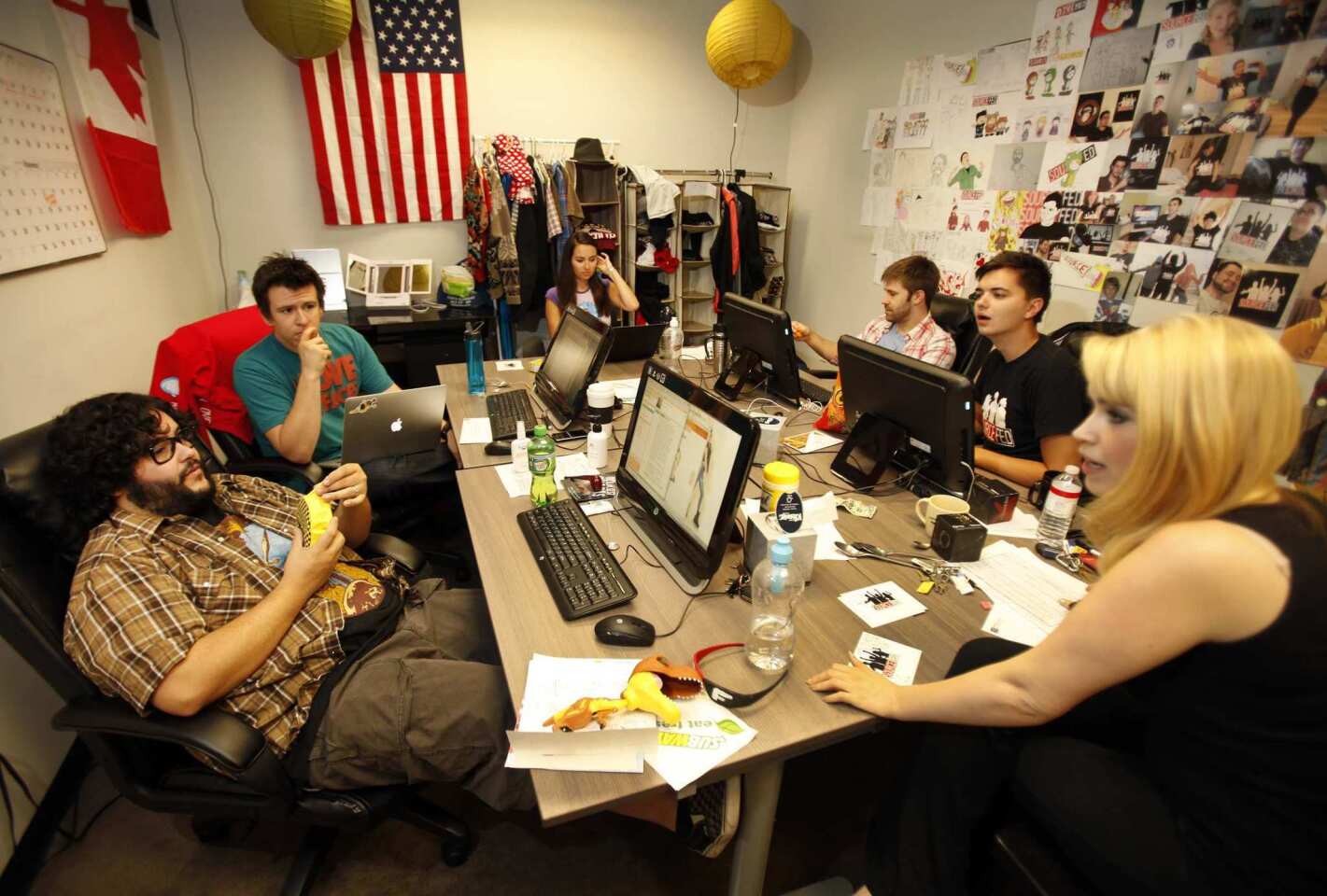 Philip DeFranco, second from left, meets with the writers/hosts of "SourceFed," a new YouTube channel show produced by DeFranco at his Woodland Hills offices.