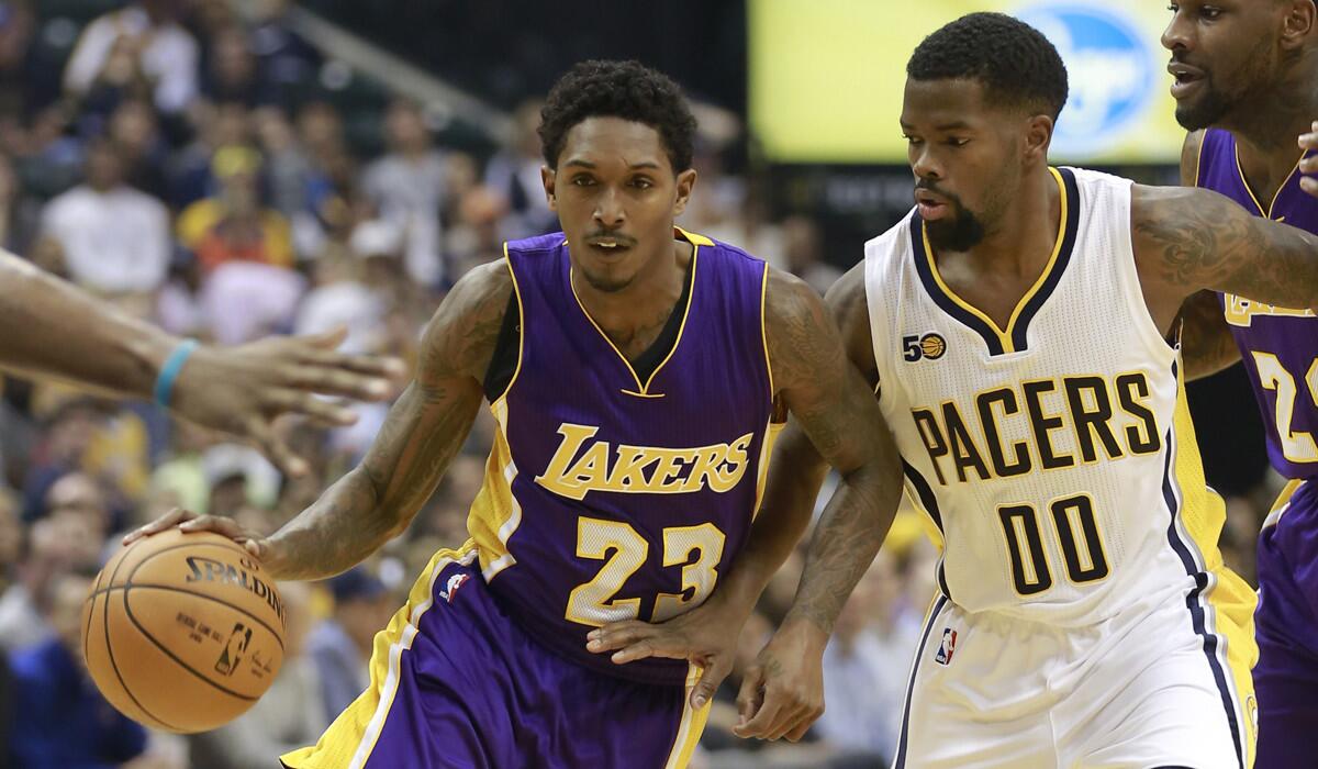 Lakers guard Lou Williams, left, drives past Indiana Pacers guard Aaron Brooks during the second half Tuesday.