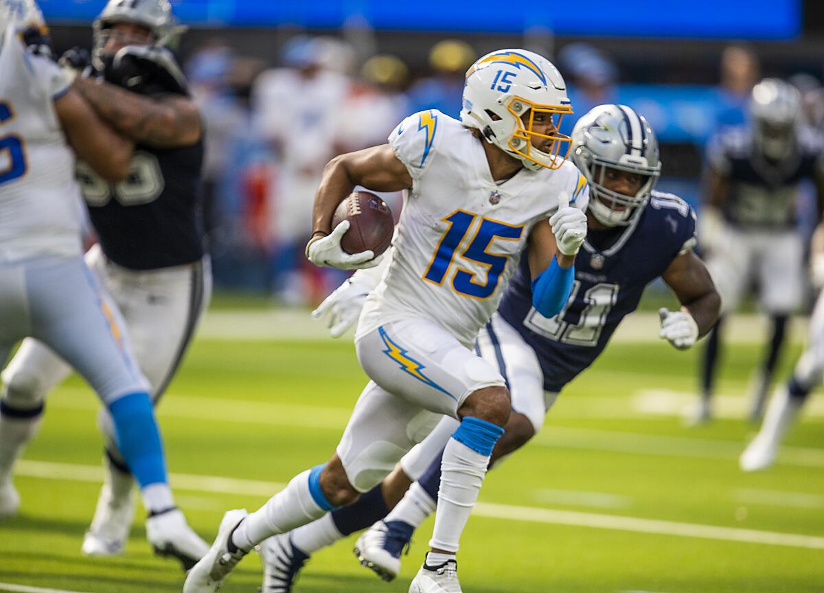 Chargers wide receiver Jalen Guyton runs past Dallas Cowboys outside linebacker Micah Parsons.