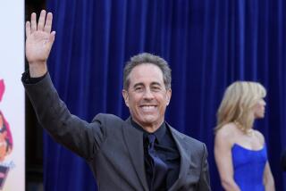 Jerry Seinfeld waves to photographers at the premiere of the Netflix film "Unfrosted" at the Egyptian Theatre, Tuesday, April 30, 2024, in Los Angeles. (AP Photo/Chris Pizzello)