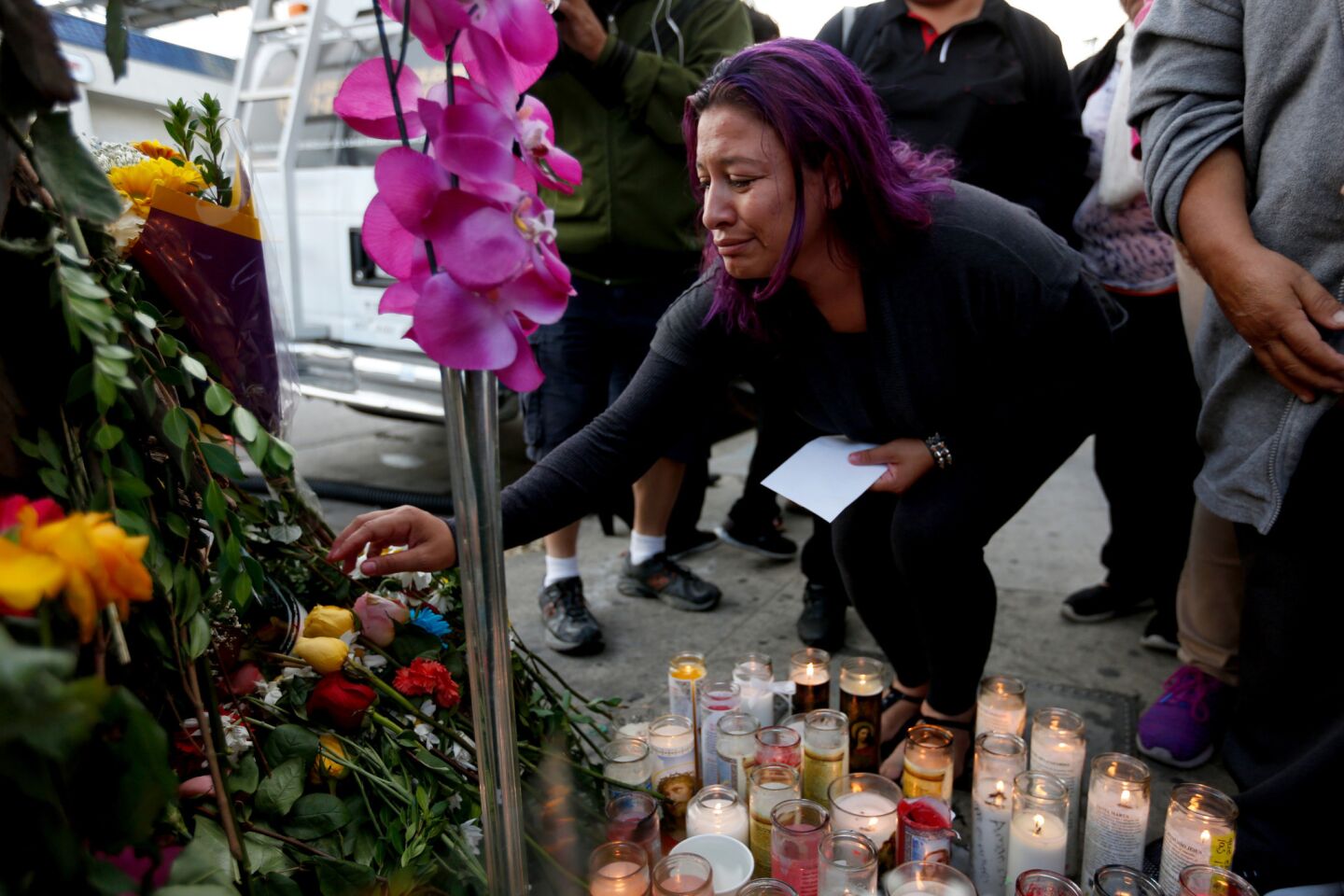 Jennifer Ruiz, 26, attends a vigil for her mother, Rosa "Rosalba" Ruiz, a victim of the crash.