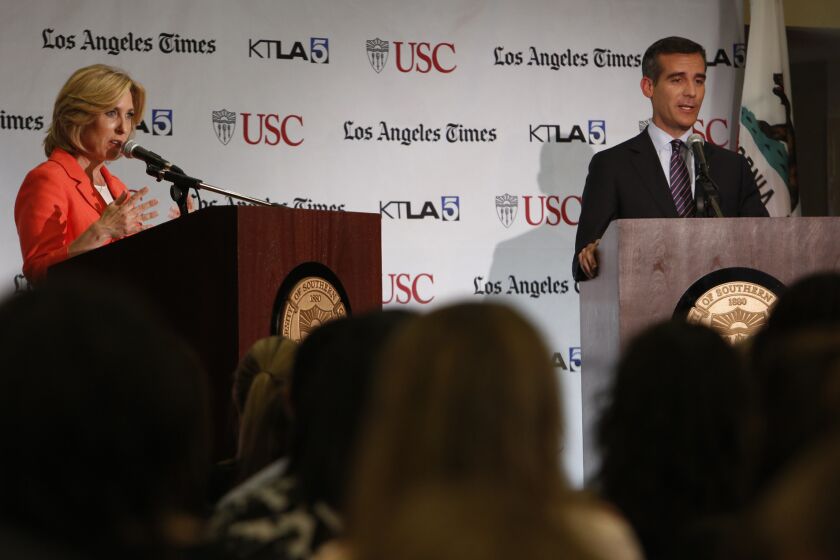 Wendy Greuel and Eric Garcetti participate in a debate at USC.