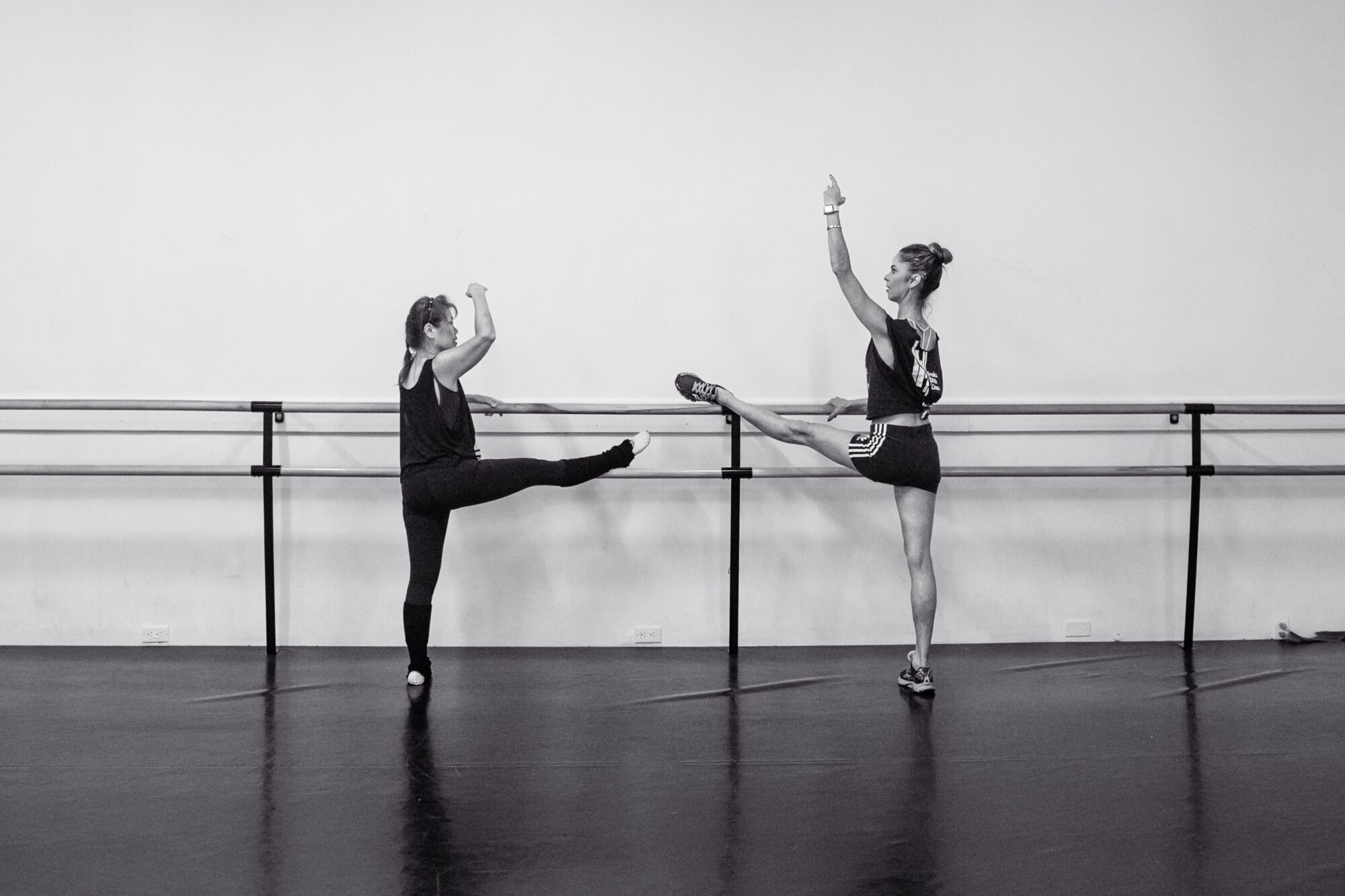 Two women practising ballet.
