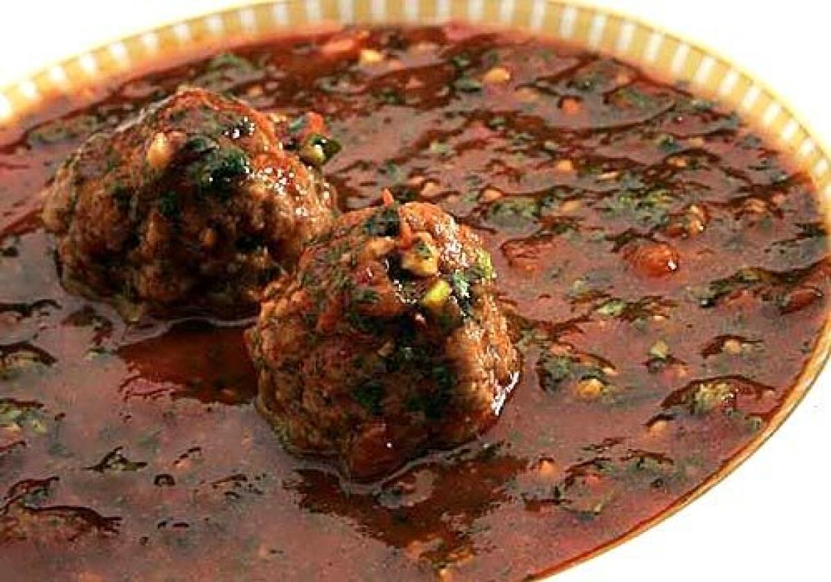 Spicy tomato soup is fortified with kibbeh meatballs.